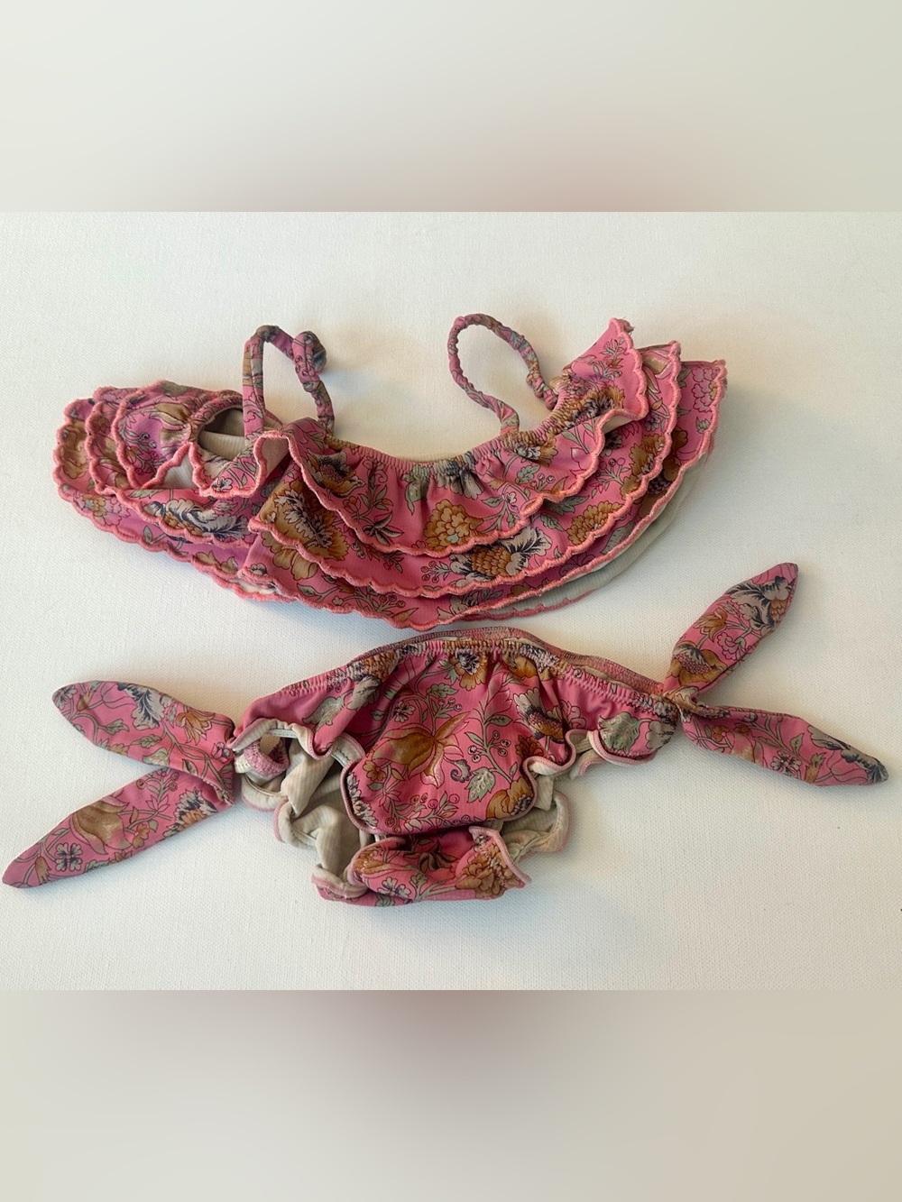 Louise Misha girl’s bikini in a floral print, a tiered ruffle top.  Size 4T.